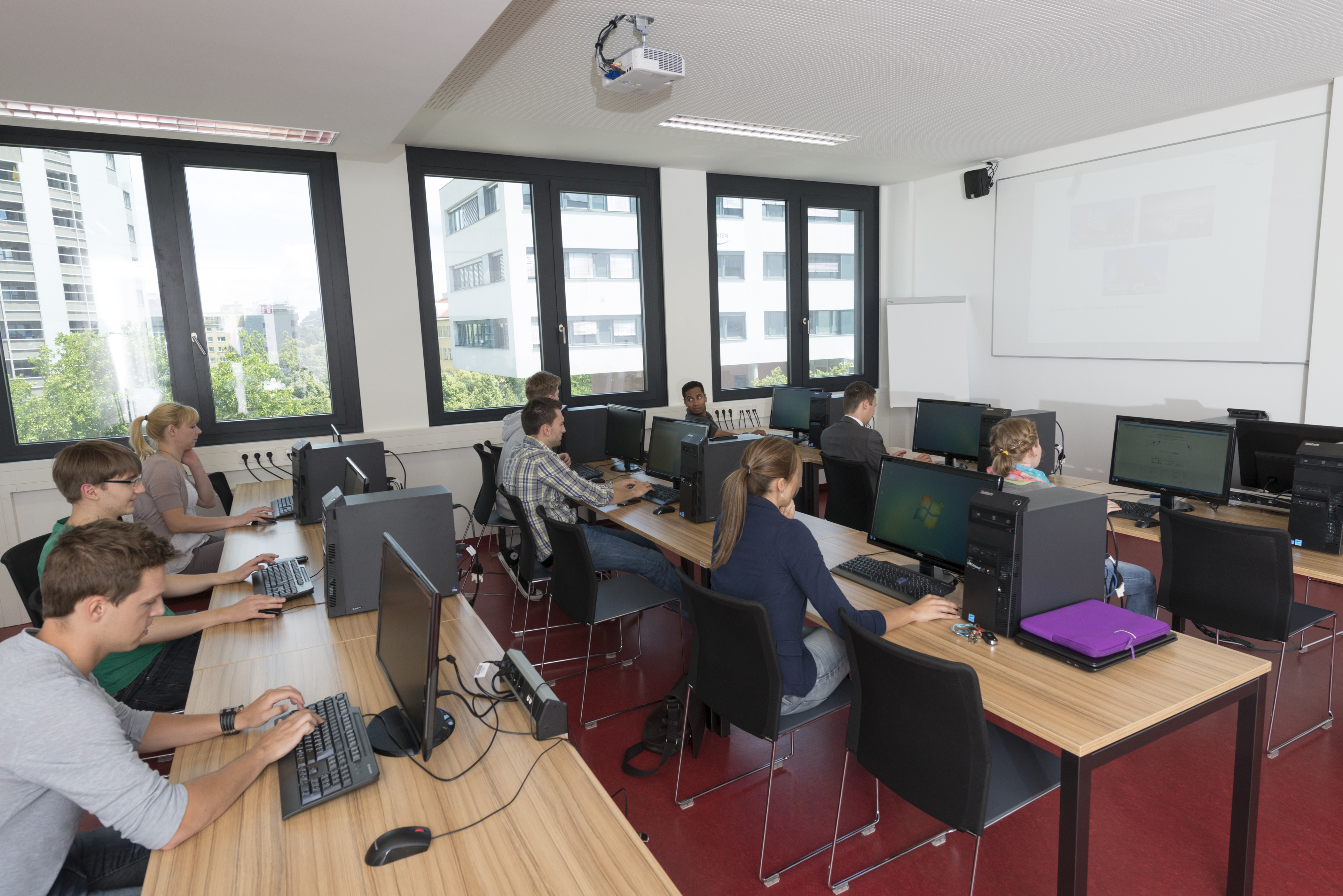 Students sitting in a classroom of the University of Applied Science Technikum Wien.